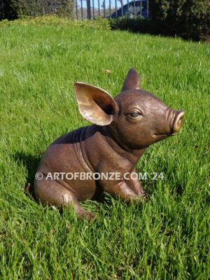 Pork Chop bronze statue of pig sitting comfortably for indoor or outdoor display