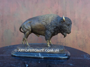 Pride of the Prairie bison bronze sculpture standing on rocky base with large horns and rich texturing