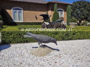 Raven bronze sculpture of standing ravens playing around fountain