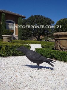 Raven bronze sculpture of standing ravens playing around fountain