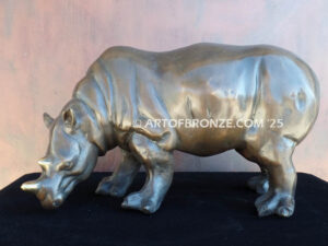 Grazing black rhino high-quality bronze statue for indoor home and office display
