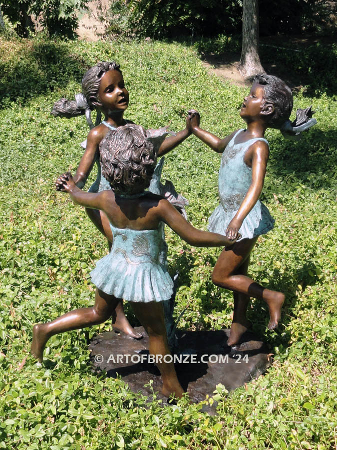 Ring Around fountain sculpture of three girls holding hands and dancing around