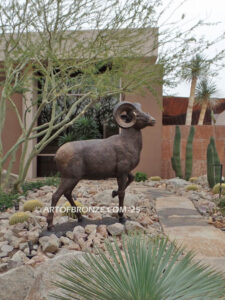Rocky Mountain King monumental outdoor bronze sculpture big horn sheep ram on bronze rock ledge