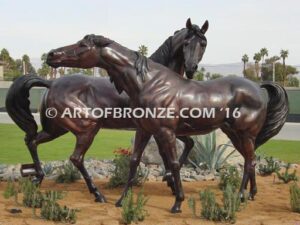 Romance bronze sculpture of standing mare and running colt horse for Griffin Ranch in La Quinta, CA