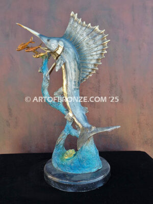 Sailfish Roundup bronze sculpture of sailfish leaping toward school of fish