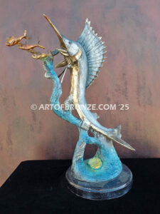 Sailfish Roundup bronze sculpture of sailfish leaping toward school of fish