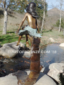 Sanctuary bronze statue beautiful girl gracefully resting on branch in bathing suit