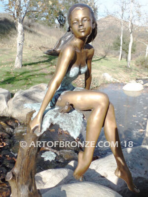 Sanctuary bronze statue beautiful girl gracefully resting on branch in bathing suit