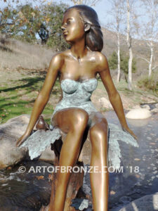 Sanctuary bronze statue beautiful girl gracefully resting on branch in bathing suit