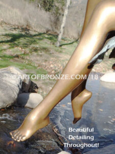Sanctuary bronze statue beautiful girl gracefully resting on branch in bathing suit