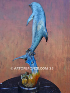 Scenic Route dolphin leaping above waves bronze statue