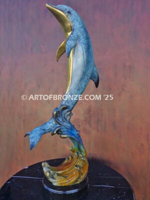 Scenic Route dolphin leaping above waves bronze statue