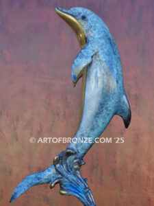 Scenic Route dolphin leaping above waves bronze statue