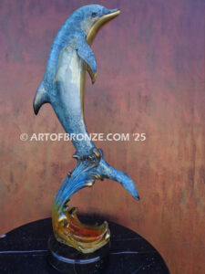 Scenic Route dolphin leaping above waves bronze statue