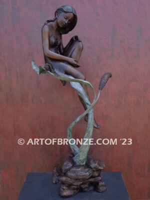 secret garden bronze statue beautiful girl gracefully resting on pampas grass leaf