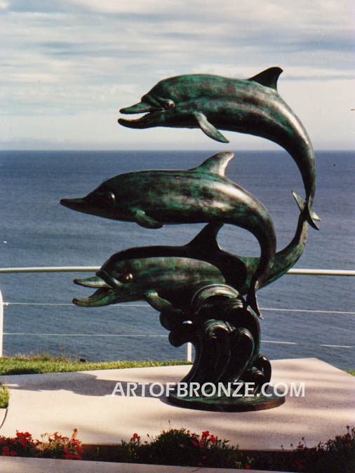 Soul Surfers marine life bronze cast three dolphin sculpture monument