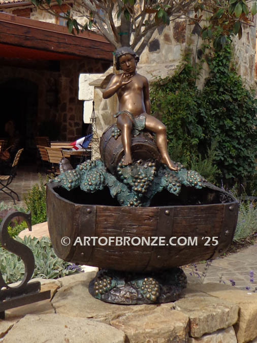 Special Reserve bronze statue fountain of cherub sitting on wine barrel