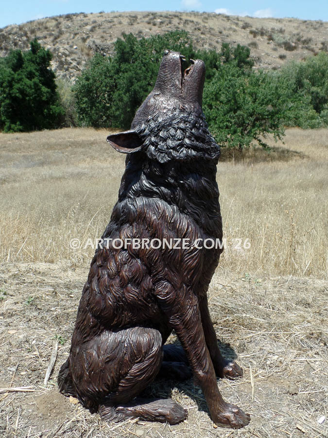 Spirit Howler bronze sitting wolf statue howling at the moon