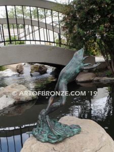 Bronze sculpture of leaping life-size frog for outdoor pond, pool or aquatic display