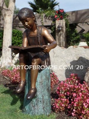 Study Time bronze sculpture of young reader girl sitting on bronze stump