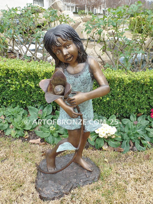 Summer Bloom indoor bronze sculpture of girl holding flower