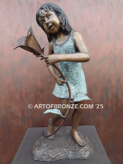 Summer Bloom indoor bronze sculpture of girl holding flower