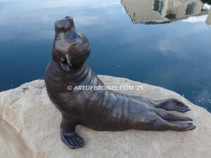 Sunbather bronze sea lion and seal mascot sculpture for zoo, university or school mascot