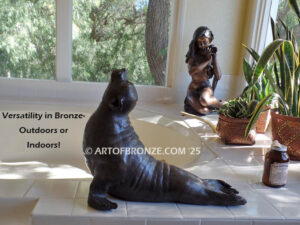 Sunbather bronze sea lion and seal mascot sculpture for zoo, university or school mascot