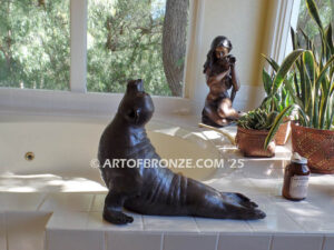 Sunbather bronze sea lion and seal mascot sculpture for zoo, university or school mascot