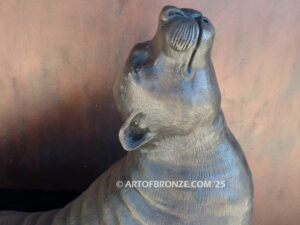 Sunbather bronze sea lion and seal mascot sculpture for zoo, university or school mascot