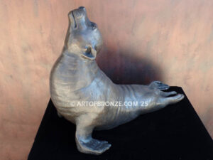 Sunbather bronze sea lion and seal mascot sculpture for zoo, university or school mascot