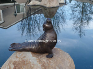 Sunbather bronze sea lion and seal mascot sculpture for zoo, university or school mascot
