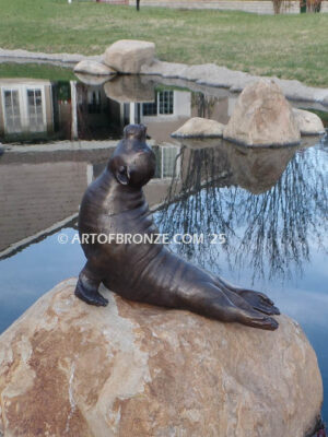 Sunbather bronze sea lion and seal mascot sculpture for zoo, university or school mascot