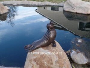Sunbather bronze sea lion and seal mascot sculpture for zoo, university or school mascot