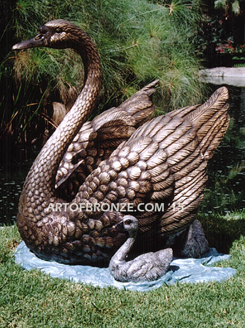 Swan Lake bronze statue of mother swan swimming with her cygnets