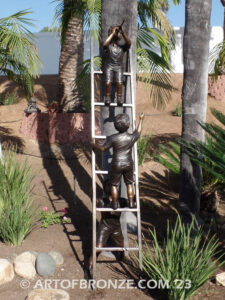 Team work bronze statue of two boys climbing on ladder for outdoor display