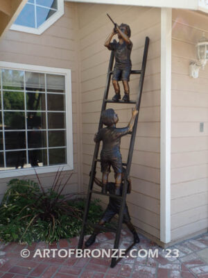 Team work bronze statue of two boys climbing on ladder for outdoor display