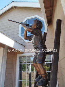 Team work bronze statue of two boys climbing on ladder for outdoor display