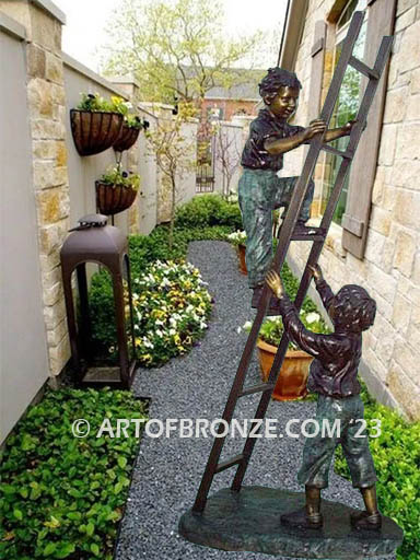Team work bronze sculpture of two boys playing on ladder for outdoor display