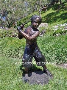 Teed up bronze sculpture of junior golfer practicing for USPGA