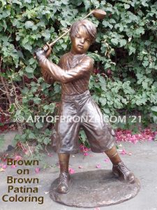 Teed up bronze sculpture of junior golfer practicing for USPGA