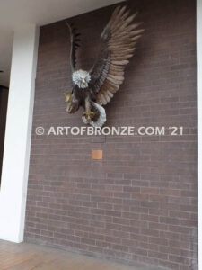 Thunder and Lightning heroic bronze eagle statue anchored to brick wall