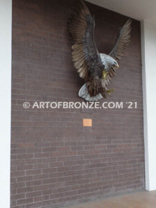 Thunder and Lightning heroic bronze eagle statue anchored to brick wall