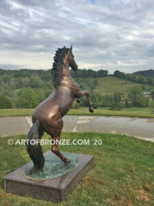 Thunderstorm bronze statue of rearing horse with forelegs off the ground and hind legs attached bronze base
