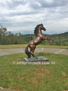 Thunderstorm bronze statue of rearing horse with forelegs off the ground and hind legs attached bronze base