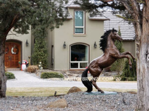 Thunderstorm bronze statue of rearing horse with forelegs off the ground and hind legs attached bronze base