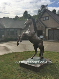 Thunderstorm bronze statue of rearing horse with forelegs off the ground and hind legs attached bronze base