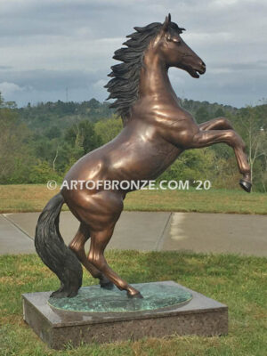 Thunderstorm bronze statue of rearing horse with forelegs off the ground and hind legs attached bronze base