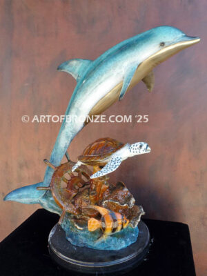 Treasure Finders dolphin leaping above sea turtle bronze statue