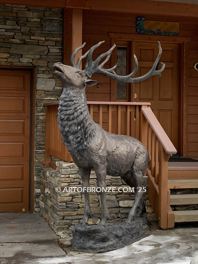 Unyielding Terrain Heroic bronze statue bull elk standing on rocky base design with head raised in bugling position